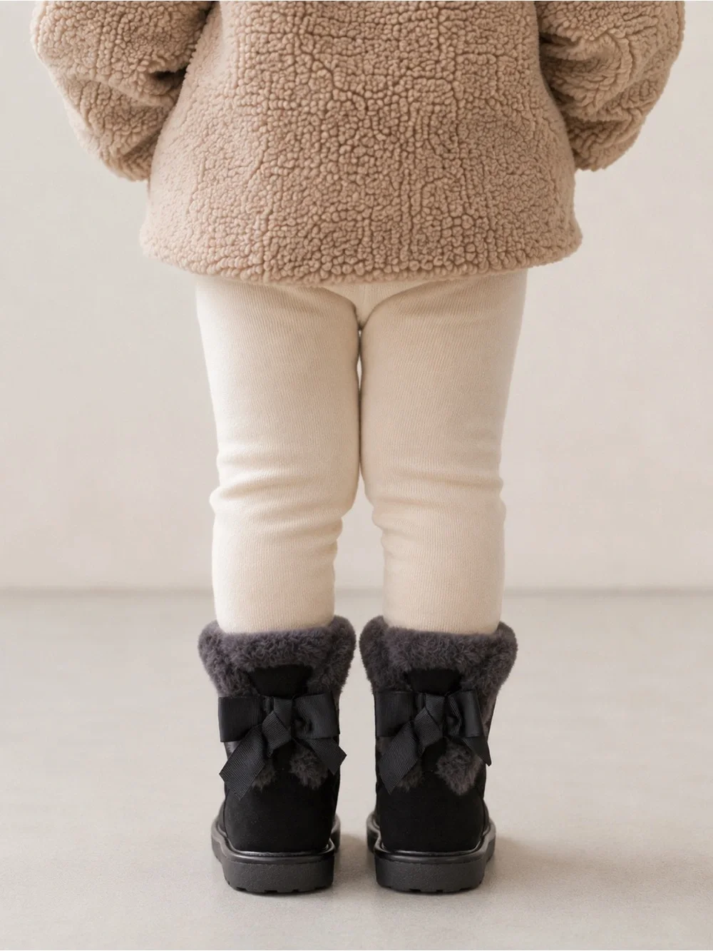 London Fog Collection Black Cozy Faux Fur Winter Bow Back Boots